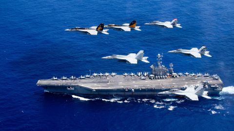 Aircraft fly above the USS John C. Stennis as it travels through the Philippine Sea on Saturday, June 18.
