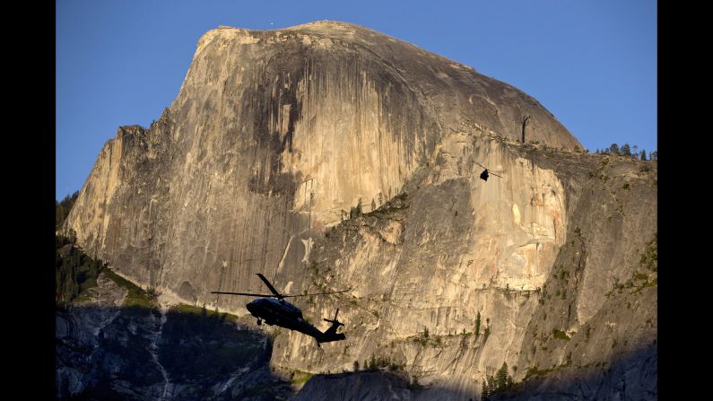 Marine One is silhouetted against the Half Dome rock formation as the first family arrives at Yosemite National Park on Friday, June 17. <a href="index.php?page=&url=http%3A%2F%2Fwww.cnn.com%2F2016%2F05%2F27%2Fpolitics%2Fgallery%2Fus-military-may-photos%2Findex.html" target="_blank">See U.S. military photos from May</a>