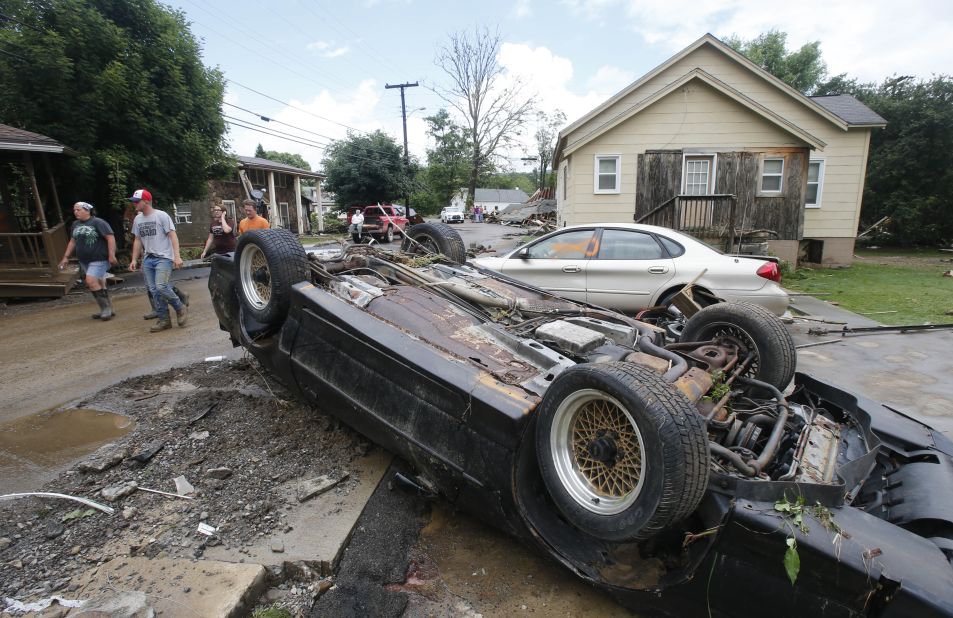 Overturned cars litter the street in White Sulphur Springs on June 24.
