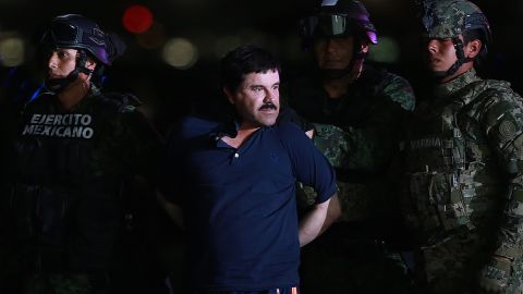 Guzman is escorted by Mexican security forces at a Navy hangar in Mexico City, Mexico in 2016. 