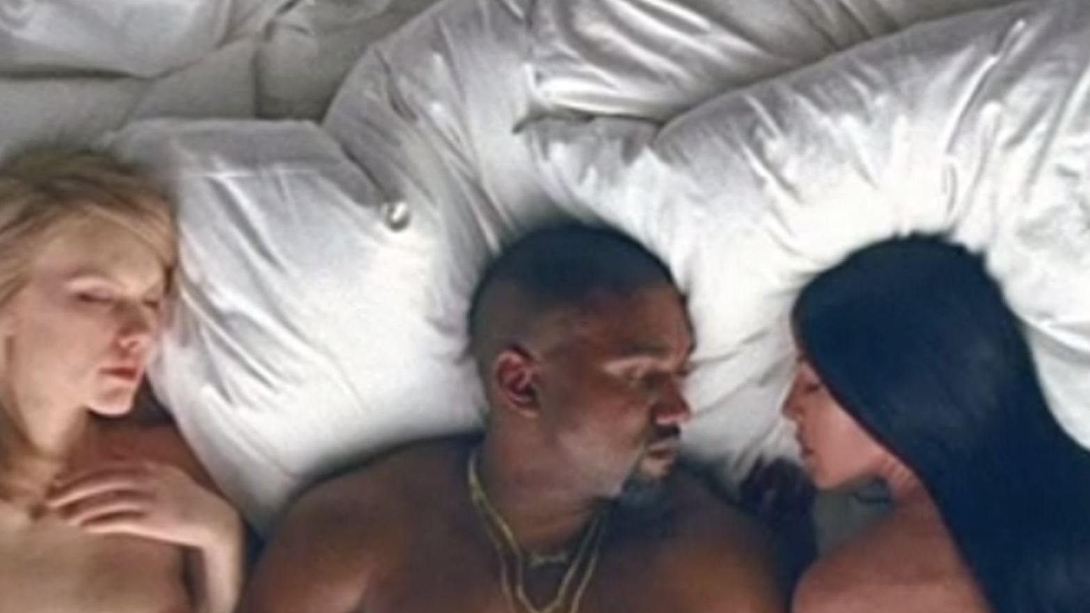 In Kanye West's new video for "Famous," he appears in bed with likenesses of several celebrities, including Taylor Swift, left, and Kim Kardashian, West's wife.