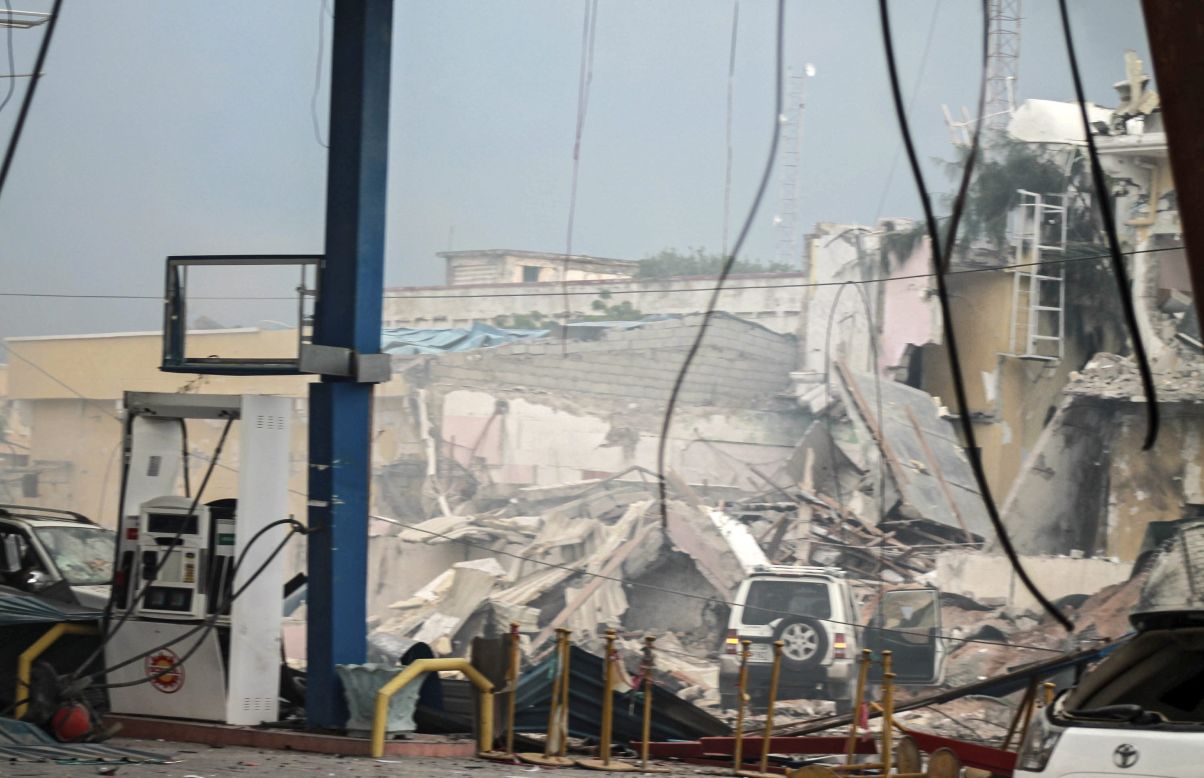 The destroyed hotel,seen behind a gas station, is  frequented by Somali government officials, lawmakers and security officers, Dahir said. The blast was followed by a gun battle inside the hotel.
