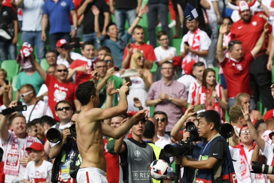 Poland forward Robert Lewandowski celebrates his team's victory over Switzerland in a penalty shoot-out Saturday, June 25, at the Geoffroy-Guichard stadium in Saint-Etienne, France.