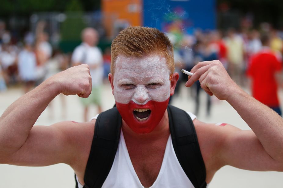 A Poland supporter cheers on his team. 