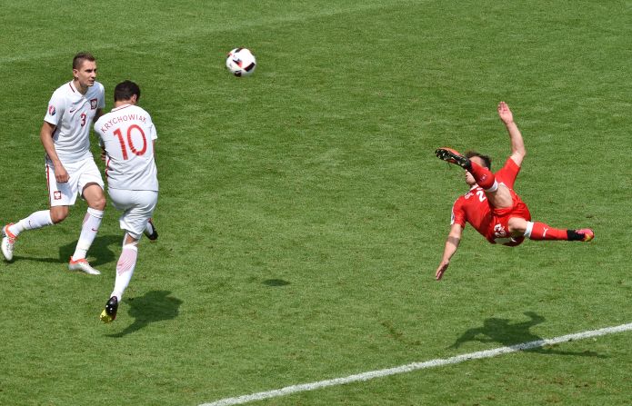 Shaqiri shoots to score on the volley in the 82nd minute.