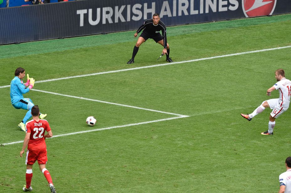 Poland midfielder Jakub Blaszczykowski, right, shoots to score past Switzerland goalkeeper Yann Sommer. 
