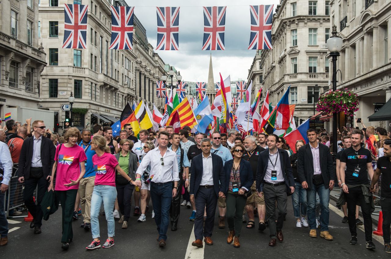 London Mayor Sadiq Khan, center, and his wife Saadiya Khan lead a march during Pride in London on June 25.