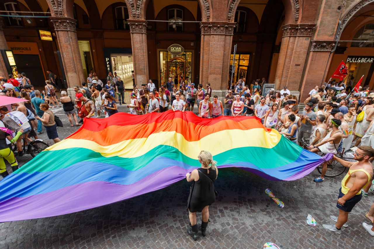 Marchers walk with a giant rainbow flag during the Pride parade in Bologna, Italy, on June 25.