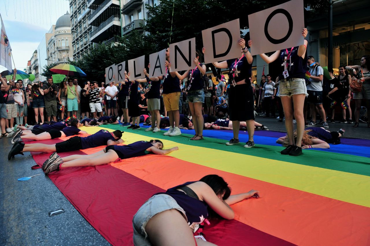 People hold placards reading "Orlando" in memory of the victims of Orlando's gay nightclub shooting as thousands of people parade in the streets of Thessaloniki, Greece, during the city's 5th Gay Pride march on June 25.