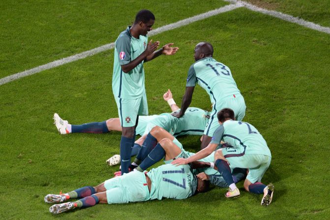 Portugal players celebrate at the end of the match.