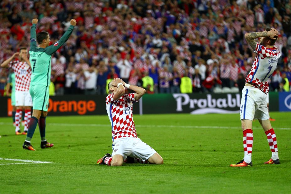 Domagoj Vida, center, of Croatia reacts after his shot goes wide.