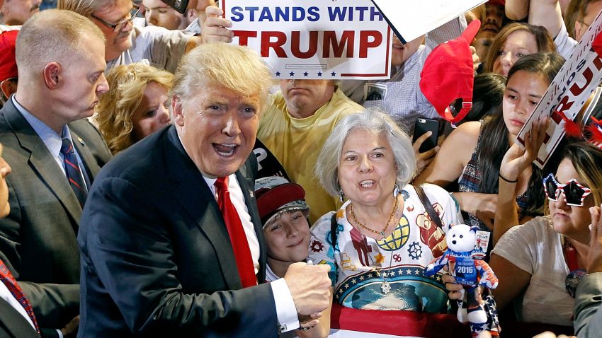 PHOENIX, AZ - JUNE 18:  Republican presidential candidate Donald Trump poses for a photo with supporter Diana Brest (C) during a campaign rally on June 18, 2016 in Phoenix, Arizona.  Trump returned to Arizona for the fourth time since starting his presidential campaign a year ago. (Photo by Ralph Freso/Getty Images)