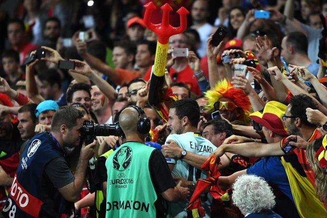 Belgian forward Eden Hazard, center, celebrates with supporters after Belgium's 4-0 victory over Hungary, at the Stadium Municipal in Toulouse, France on Sunday, June 26. 