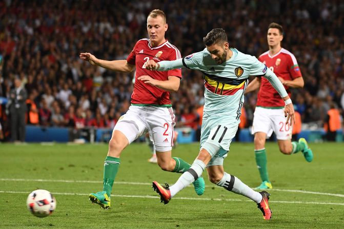 Belgium's forward Yannick Ferreira-Carrascoa, right, shoots and scores his team's fourth goal.