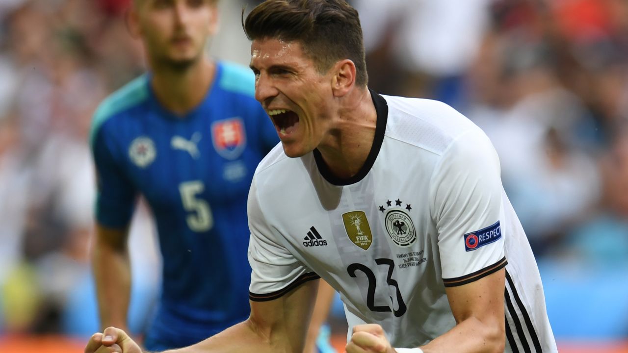 Germany's forward Mario Gomez celebrates after scoring a goal during the Euro 2016 round of 16 football match between Germany and Slovakia at the Pierre-Mauroy stadium in Villeneuve-d'Ascq near Lille on June 26, 2016. / AFP / PATRIK STOLLARZ        (Photo credit should read PATRIK STOLLARZ/AFP/Getty Images)