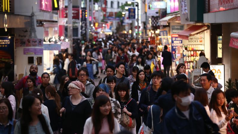 People walk along a shopping street in the Harajuku area of Tokyo, Japan, which came in fifth place. 