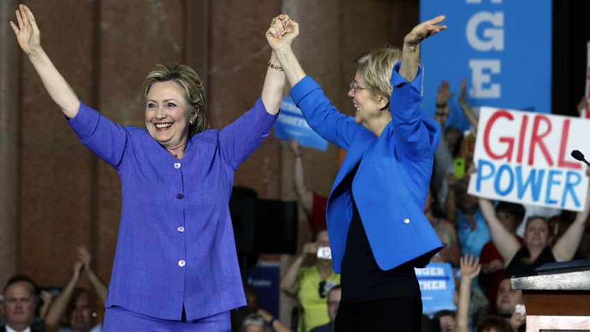 Democratic Presidential candidate Hillary Clinton (L) and U.S. Sen Elizabeth Warren (D-MA) (R) wave to the crowd before a campaign rally at the Cincinnati Museum Center at Union Terminal June 27, 2016 in Cincinnati, Ohio. Warren is helping Clinton campaign in Ohio.