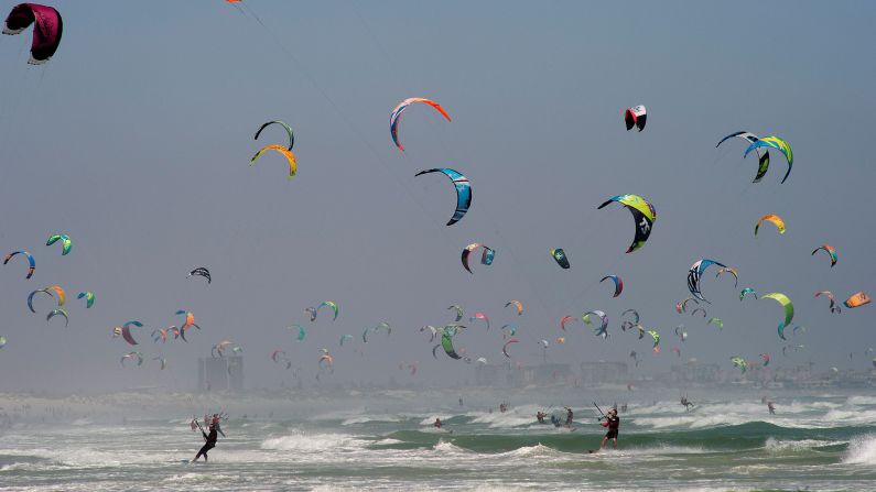 Kite surfers take part in the Kitesurfing Armada in Cape Town, South Africa.