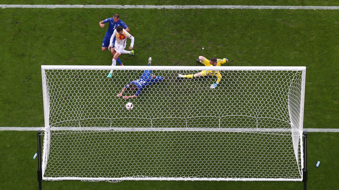 Giorgio Chiellini of Italy scores against Spain in Euro 2016. 