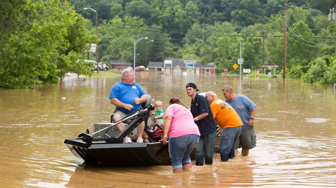 People are transported on a boat during flooding in West Virginia on Sunday, June 26. <a href="http://www.cnn.com/2016/06/25/us/west-virginia-flooding-deaths/" target="_blank">Fast-moving floodwaters</a> have killed at least 24 people, state officials said.