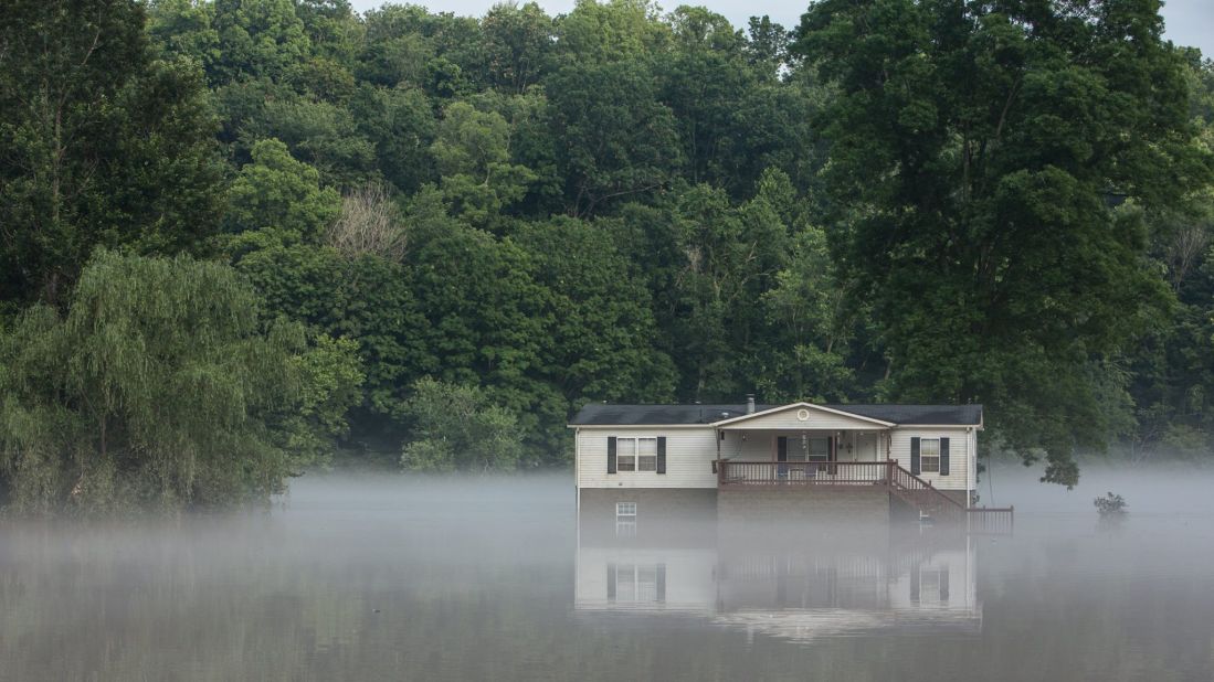 Water surrounds a house in Clendenin, West Virginia, on June 26.