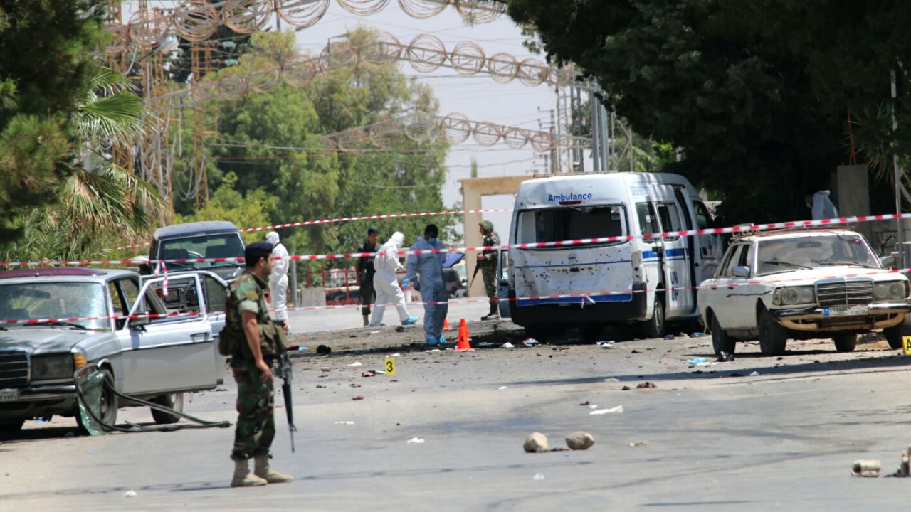 Lebanese security forces secure the site of the suicide attacks.