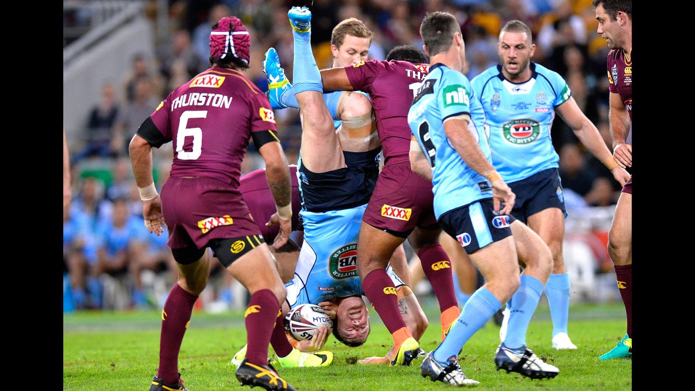 Paul Gallen, a rugby player for New South Wales, is tackled by Queensland's Sam Thaiday during game two of the State of Origin series on Wednesday, June 22. Queensland won 26-16 in Brisbane, Australia.