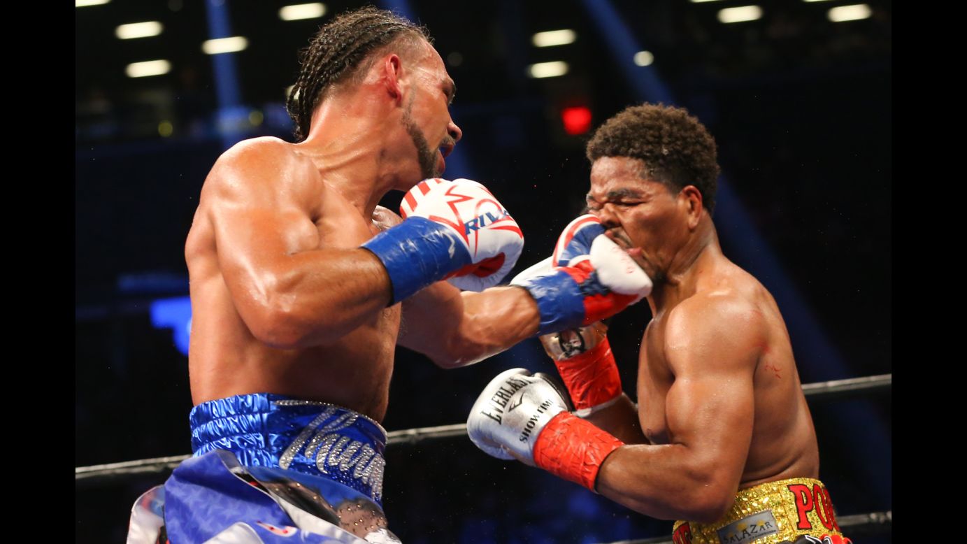 Keith Thurman lands a left hand to the head of Shawn Porter during their welterweight title fight in New York on Saturday, June 25. Thurman won by unanimous decision to retain his WBA belt.