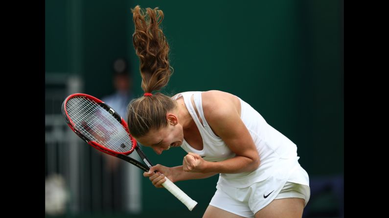 Ekaterina Alexandrova celebrates her first-round Wimbledon victory over Ana Ivanovic on Monday, June 27. It was her first match ever in the main draw of a Grand Slam.