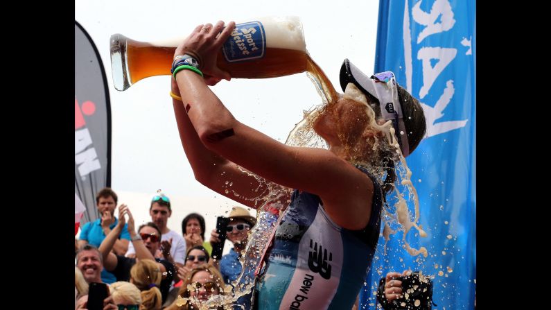 Australian triathlete Mirinda Carfrae celebrates she won the Ironman race in Klagenfurt, Austria, on Sunday, June 26.