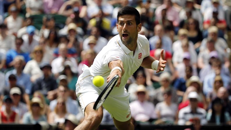 Novak Djokovic plays a shot during his first-round match at Wimbledon on Monday, June 27. Djokovic, who has won the last four Grand Slams, defeated James Ward in straight sets.