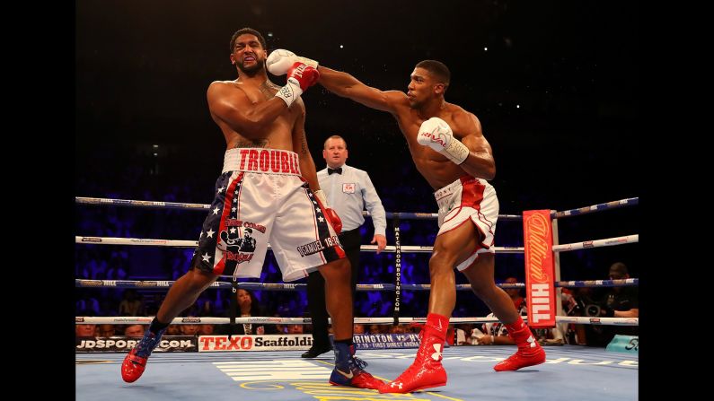 Anthony Joshua punches Dominic Breazeale during their heavyweight title bout in London on Saturday, June 25. Joshua knocked out Breazeale in the seventh round to retain the IBF title. <a href="index.php?page=&url=http%3A%2F%2Fwww.cnn.com%2F2016%2F06%2F21%2Fsport%2Fgallery%2Fwhat-a-shot-sports-0621%2Findex.html" target="_blank">See 28 amazing sports photos from last week</a>