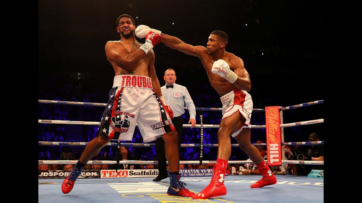Anthony Joshua punches Dominic Breazeale during their heavyweight title bout in London on Saturday, June 25. Joshua knocked out Breazeale in the seventh round to retain the IBF title. <a href="http://www.cnn.com/2016/06/21/sport/gallery/what-a-shot-sports-0621/index.html" target="_blank">See 28 amazing sports photos from last week</a>