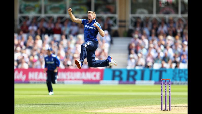 England's David Willey celebrates the wicket of Sri Lanka's Kusal Perera during a One Day International match in Nottingham, England, on Tuesday, June 21.
