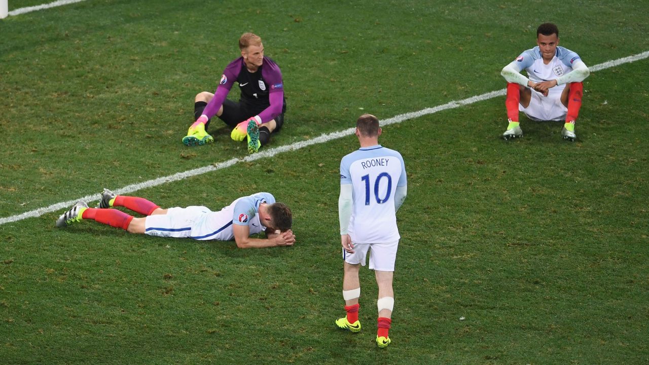 Wayne Rooney walks over to console his teammates -- from left, Gary Cahill, Joe Hart and Dele Alli -- after England were upset 2-1 by Iceland on Monday, June 27. Iceland will play France in the tournament's quarterfinals. England has been eliminated.