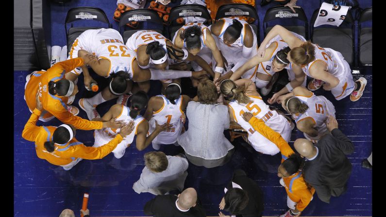 Tennessee players and head coach Pat Summitt join hands before taking the court against Kentucky in an NCAA college basketball championship game at the Southeastern Conference tournament on March 6, 2011, in Nashville.