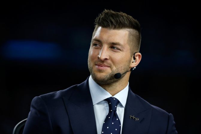 SEC Network analyst Tim Tebow speaks on air before the Goodyear Cotton Bowl on December 31, 2015, in Arlington, Texas. The 2007 Heisman Trophy winner and former NFL quarterback has been a popular and polarizing figure since his college days at the University of Florida.
