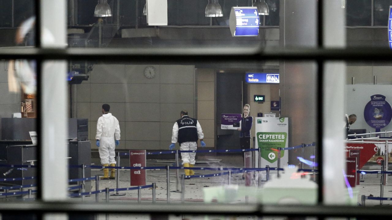 Police investigators work inside the airport.