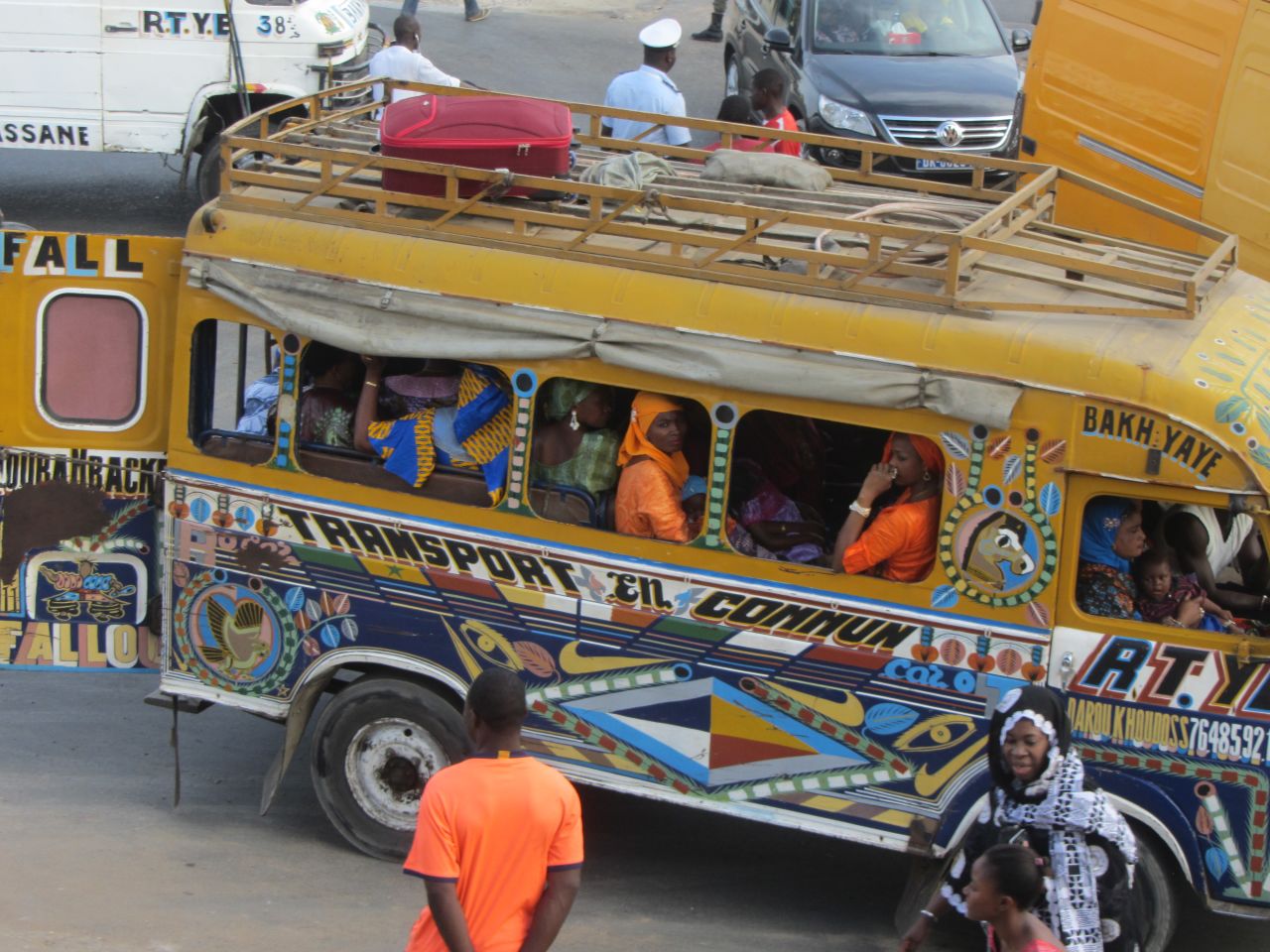 Women and children cram into a car rapides in Dakar, which the city's public transport body says are being phased out due to old age, comfort and the environmental impact of the 40-year old buses. 