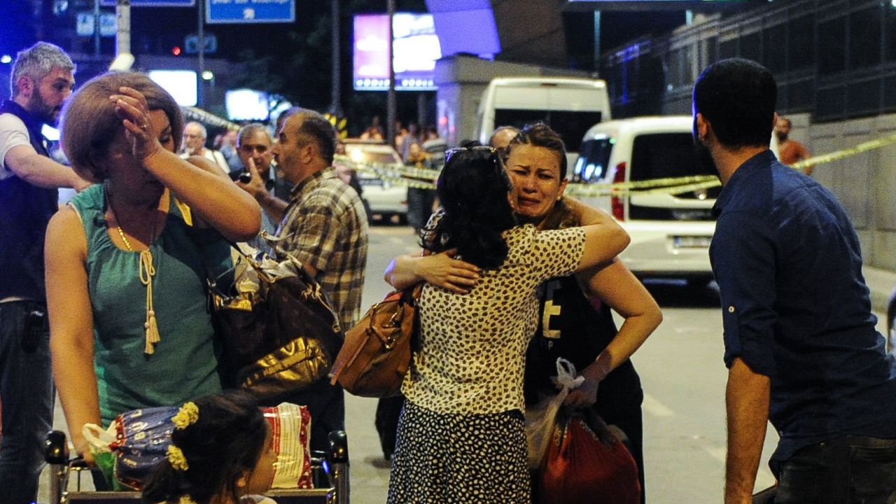 Passengers cry as they leave the airport.