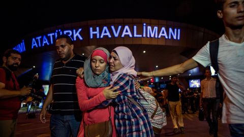 People flee the scene of a terror attack at Istanbul's Ataturk airport on Tuesday, June 28. Three terrorists armed with bombs and guns attacked the main international terminal, opening fire and eventually detonating their devices.