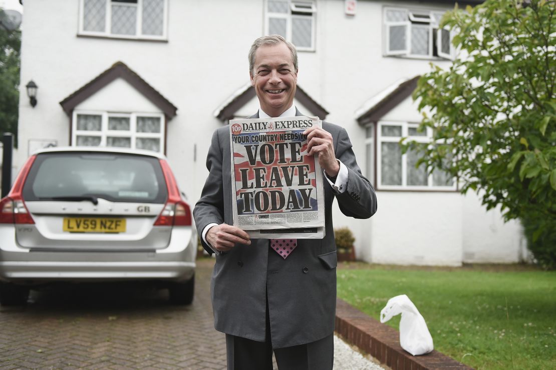 Nigel Farage holds up the Daily Express on June 23, as Brits voted in the referendum.