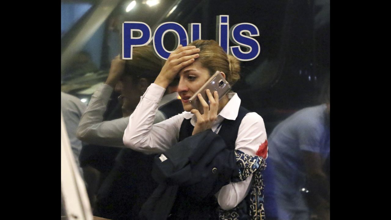 A wounded woman talks on the phone following the attack.