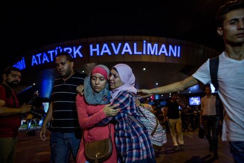<strong>June 29:</strong> Travelers embrace outside Istanbul's Ataturk airport after a deadly terror attack there. Three terrorists armed with bombs and guns <a href="http://www.cnn.com/2016/06/28/europe/gallery/istanbul-airport-attacked/index.html" target="_blank">attacked the main international terminal,</a> opening fire and eventually detonating their devices. <a href="http://www.cnn.com/interactive/2016/07/world/turkey-terror-cnnphotos/" target="_blank">Turkey in the shadow of terror</a>
