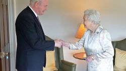 In this handout image received from the Northern ireland Office on June 27, 2016, Britain's Queen Elizabeth II shakes hands with Northern Ireland Deputy First Minister Martin McGuinness (L) at Hillsborough Castle, south of Belfast on June 27, 2016 on the start of a two day visit to the province. / AFP / Northern Ireland Office / Aaron McCracken/Harrisons 07778        (Photo credit should read AARON MCCRACKEN/HARRISONS 07778/AFP/Getty Images)