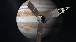 This artist's rendering shows NASA's Juno spacecraft making a close pass over Jupiter.