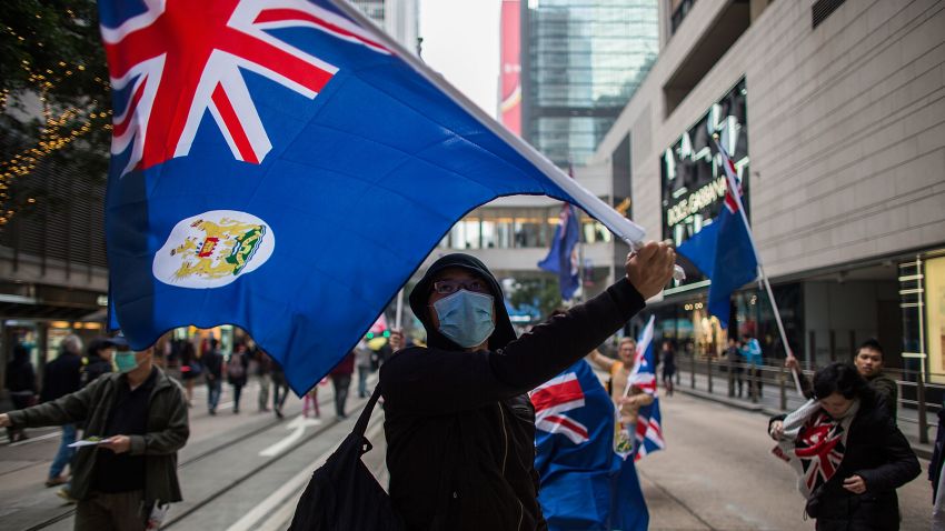HONG KONG - FEBRUARY 01:  Pro-democracy protesters wave the flag of colonial Hong Kong during a march for democracy on February 1, 2015 in Hong Kong, Hong Kong. Thousands of pro-democracy supporters gathered in Hong Kong for the first major rally since the occupy movement took over parts of Hong Kong, a stand off that lasted over 2 months. Protestors are calling for autonomy in Hong Kong chief executive elections as China continues to have control over who can run for the position.  (Photo by Lam Yik Fei/Getty Images)