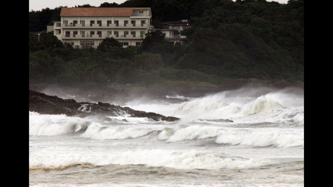 High waves crash into the coast at Hyuga in Miyazaki prefecture, Japan's southern island of Kyushu on July 16, 2015. 