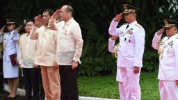 Outgoing Philippines President Benigno Aquino (center-R) and his successor Rodrigo Duterte (center-L) salute during the departure ceremony for Aquino ahead of the swearing-in at Malacanang Palace in Manila on June 30, 2016. 
Authoritarian firebrand Rodrigo Duterte takes office as Philippine president June 30, promising a ruthless and deeply controversial war on crime as the chief focus of his six-year term. / AFP / TED ALJIBE        (Photo credit should read TED ALJIBE/AFP/Getty Images)