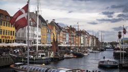 A sightseeing vessel is seen at Nyhavn canal in Copenhagen on October 9, 2015. Hosting historical wooden ships, the 17th-century waterfront, canal and entertainment district is popular with tourists visiting the Danish capital. AFP PHOTO / ODD ANDERSEN        (Photo credit should read ODD ANDERSEN/AFP/Getty Images)